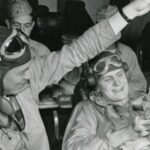 pilots on a US Navy aircraft carrier relax by playing with